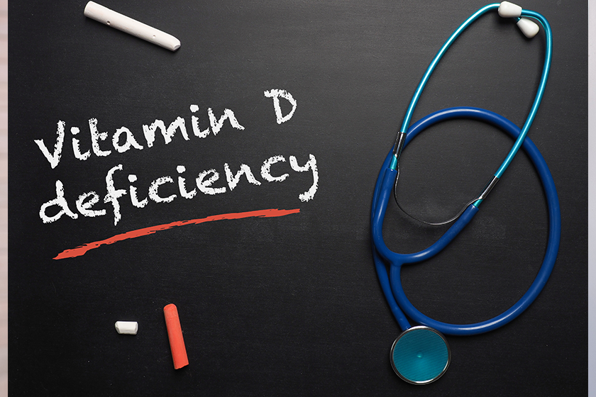 Blackboard with the words Vitamin D deficiency and a stethoscope, medical or health care concept 